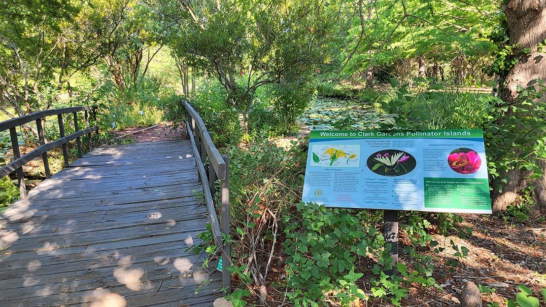 Welcome sign for Pollinator Island in place at Clark Gardens